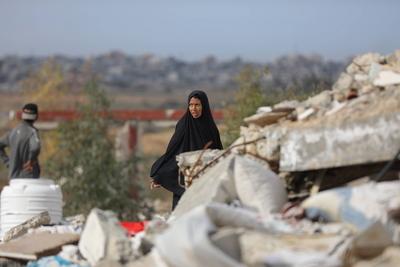 Palestinians inspect the damage to the TIKA towers after the Israeli occupation army withdrew from the Juhr al-Dik area, as part of a ceasefire agreement with Hamas in Gaza City-stock-photo