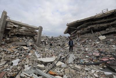 Palestinians inspect the damage to the TIKA towers after the Israeli occupation army withdrew from the Juhr al-Dik area, as part of a ceasefire agreement with Hamas in Gaza City-stock-photo