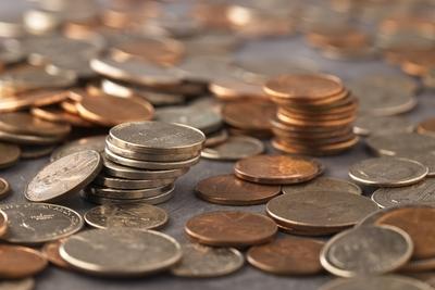 Close up photo of various US coins. A concept close up photo of various US coins bunched together in a studio setting. C-stock-photo