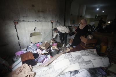 Residents inspect the damage done as Israeli troops withdraw from Al Farea refugee camp following a four-day campaign, near the West Bank city of Tubas-stock-photo