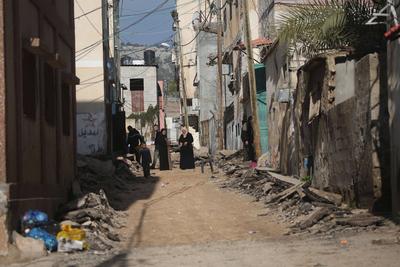 Residents inspect the damage done as Israeli troops withdraw from Al Farea refugee camp following a four-day campaign, near the West Bank city of Tubas-stock-photo