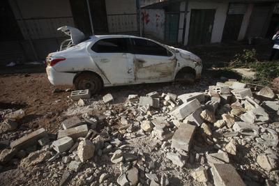 Residents inspect the damage done as Israeli troops withdraw from Al Farea refugee camp following a four-day campaign, near the West Bank city of Tubas-stock-photo