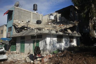 Residents inspect the damage done as Israeli troops withdraw from Al Farea refugee camp following a four-day campaign, near the West Bank city of Tubas-stock-photo