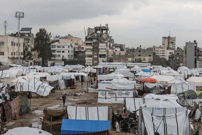 Displaced Palestinians take shelter in tents set up at the Yarmouk stadium in Gaza City-stock-photo