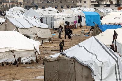 Displaced Palestinians take shelter in tents set up at the Yarmouk stadium in Gaza City-stock-photo