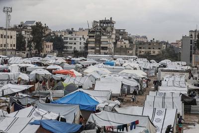 Displaced Palestinians take shelter in tents set up at the Yarmouk stadium in Gaza City-stock-photo