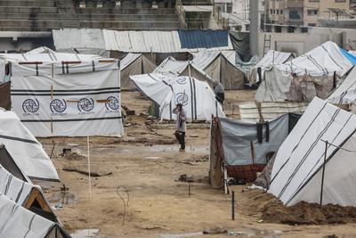Displaced Palestinians take shelter in tents set up at the Yarmouk stadium in Gaza City-stock-photo