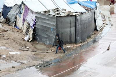 Displaced Palestinians take shelter in tents set up at the Yarmouk stadium in Gaza City-stock-photo