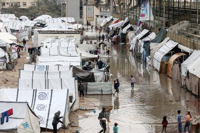 Displaced Palestinians take shelter in tents set up at the Yarmouk stadium in Gaza City-stock-photo
