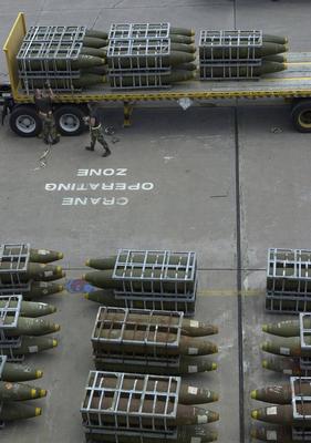 RECORD DATE NOT STATED Air Force members from the 28th Air Expeditionary Wing secure Mk-84 2,000-pound bombs to a tracto-stock-photo