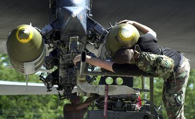 RECORD DATE NOT STATED Air Force munitions specialists from the 28th Air Expeditionary Wing download Joint Direct Attack-stock-photo