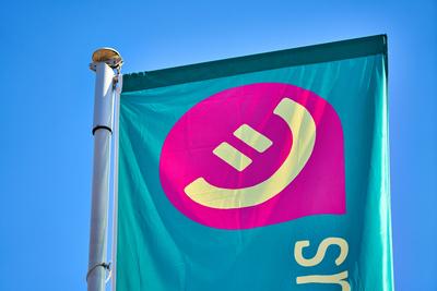 Baden-W?rttemberg, Stuttgart, Germany - 5 February 2025: A flag with the logo of the new REWE bonus program waves in the-stock-photo
