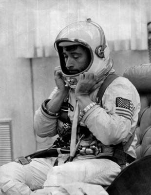Gemini-10 pilot, John W. Young (1930- ), US astronaut. He adjusts his spacesuit helmet before his three-day mission wit-stock-foto