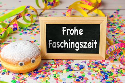 Bavaria, Germany - February 6, 2025: PHOTOMONTAGE, a festive carnival table with the inscription frohe Faschingszeit, de-stock-foto