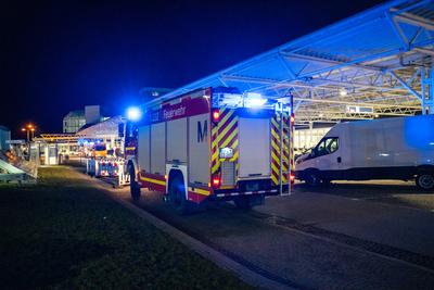 Munich, Bavaria, Germany - February 26, 2025: The Munich Airport Fire Department with blue lights in front of Terminal 1-stock-foto