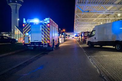 Munich, Bavaria, Germany - February 26, 2025: The Munich Airport Fire Department with blue lights in front of Terminal 1-stock-foto