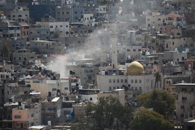 An Israeli military bulldozer demolishes Palestinian homes in the Nur Shams refugee camp east of Tulkarm-stock-photo