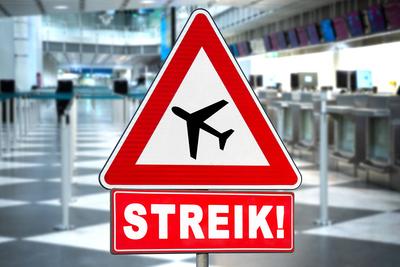 February 27, 2025: PHOTOMONTAGE, A warning sign with an airplane symbol and the words STRIKE! stands in front of an aban-stock-foto