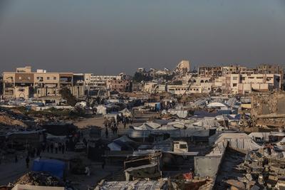 A view of the destruction as Palestinians continue their daily life with limited resources among the rubble of buildings destroyed as a result of Israeli attacks in the Sheikh Zayed Towers in Beit Lahia-stock-foto