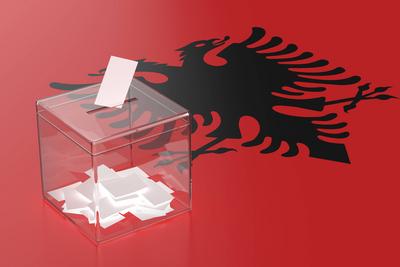 Concept image for elections in Albania Ballot box with the flag of Albania Copyright: xZoonar.com/MilexAtanasovx 2168543-stock-photo