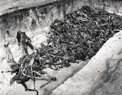 Bergen-Belsen Concentration Camp. A mass grave dug after the camp has been turned over to the Allied 21st Army Group. 55-stock-photo