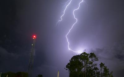 Atlantic Seaboard Thunderstorm Electrical Storm Strikes Lightpost An electrical storm producing ground to cloud lightnin-stock-photo