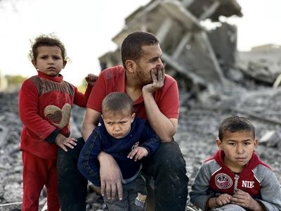 Palestinians inspect the area after Israeli attack over Khan Yunis-stock-photo
