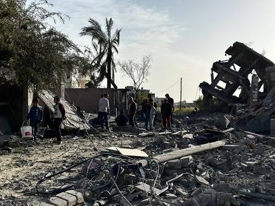 Palestinians inspect the area after Israeli attack over Khan Yunis-stock-photo