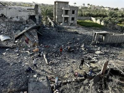 Palestinians inspect the area after Israeli attack over Khan Yunis-stock-photo