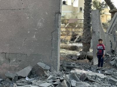 Palestinians inspect the area after Israeli attack over Khan Yunis-stock-photo