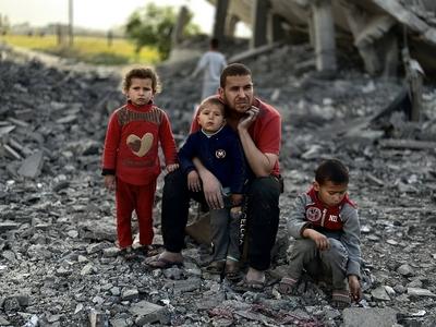 Palestinians inspect the area after Israeli attack over Khan Yunis-stock-photo