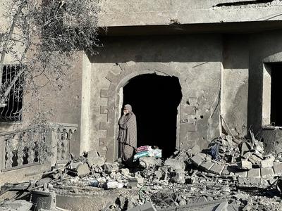 Palestinians inspect the area after Israeli attack over Khan Yunis-stock-photo