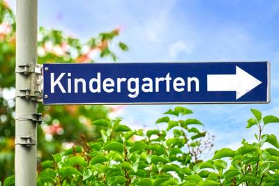 Germany - June 12, 2024: Blue signpost sign with the inscription: Kindergarten, as well as an arrow pointing to the righ-stock-foto