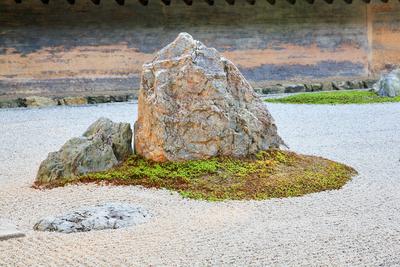 The rock garden of Ryoan-ji temple (The Temple of the Dragon at Peace). Kyoto. Japan The view of separate groups of boul-stock-photo