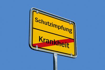 Ortsschild mit Schriftz?gen Schutzimpfung und Krankheit-stock-foto