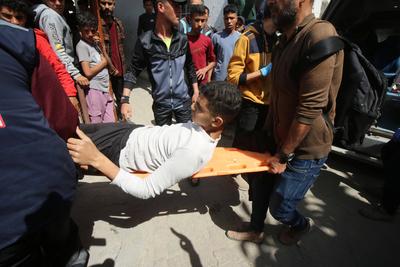 Injured Palestinians are taken to al-Ahli Baptist Hospital for medical treatment following the Israeli attack-stock-foto