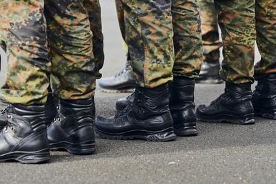Volkach, Bavaria, Germany - October 1, 2024: Soldiers of the Bundeswehr stand in formation, with their black combat boot-stock-photo
