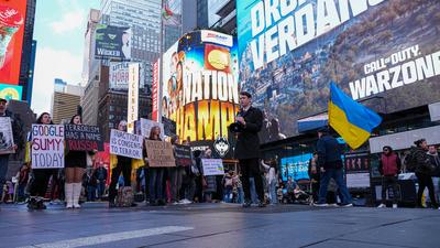 "ukrainian voices rise in times square rally after the attack"-stock-photo