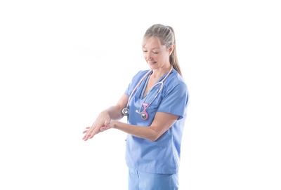 Nurse or doctor washing hands Nurse or doctor washing hands using an alcohol rub. Hand hygiene before and after a proced-stock-photo