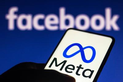 October 29, 2021, Brazil. In this photo illustration the Meta logo seen displayed on a smartphone and in the background-stock-foto