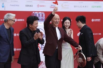 BEIJING, CHINA - APRIL 18: Actor Huang Bo (L1), comedy performer Chen Peisi (L2) arrive for the opening ceremony of the-stock-photo