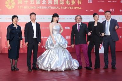 BEIJING, CHINA - APRIL 18: Actress Wu Mochou (L3) and actress Huang Yi (R2) arrive for the opening ceremony of the 15th-stock-photo