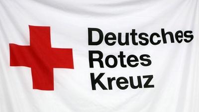 Solingen Themenbild / Symbol Schriftzug Deutsches Rotes Kreuz auf einer Fahne Eroeffnung Henry-Dunant-Dorf, Fluechtling-stock-photo