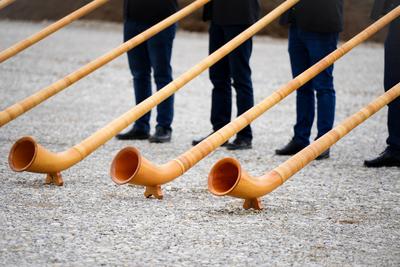 T?rkheim, Bavaria, Germany - March 4, 2024: A series of alphorns made of wood in Bavaria with beautiful decorations are-stock-photo