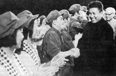 Cambodia: Saloth Sar, better known as Pol Pot, being welcomed by a Chinese opera troupe dressed in Cambodian clothing, B-stock-photo