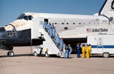 61A-S-140 (6 Nov 1985) --- The record-setting eight crewmembers for STS 61-A file from their home for the past week at t-stock-photo