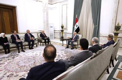 Iraqi President Abdul Latif Jamal Rashid receives Michael Keating, Executive Director of the European Peace Institute-stock-photo