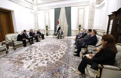 Iraqi President Abdul Latif Jamal Rashid receives Michael Keating, Executive Director of the European Peace Institute-stock-photo