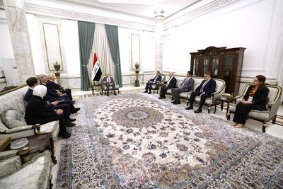 Iraqi President Abdul Latif Jamal Rashid receives Michael Keating, Executive Director of the European Peace Institute-stock-photo