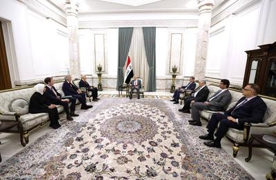 Iraqi President Abdul Latif Jamal Rashid receives Michael Keating, Executive Director of the European Peace Institute-stock-photo